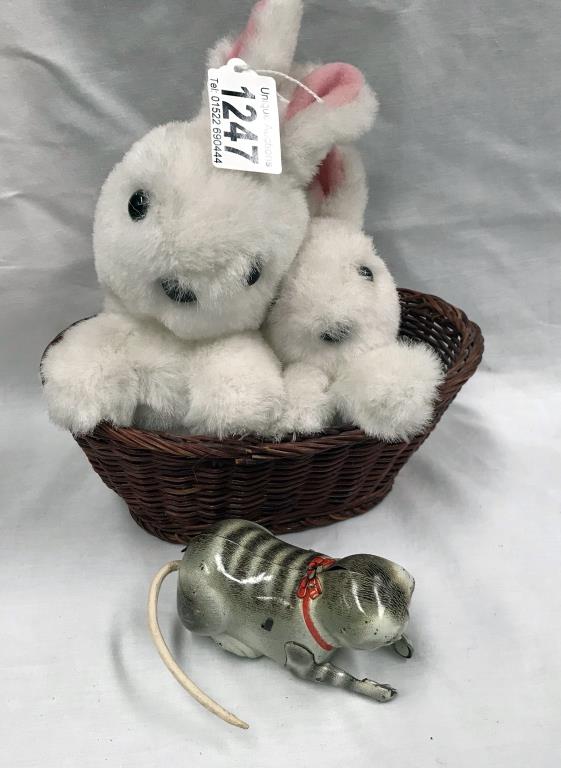 A tin plate clockwork cat & a late 20th century rabbits in basket