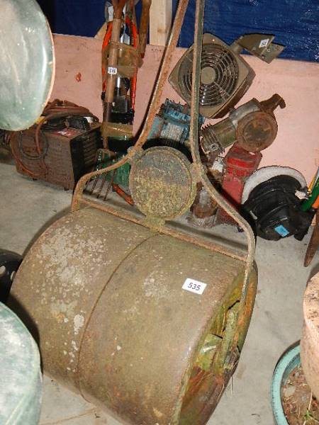 An old metal garden roller.