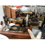 Two vintage Singer sewing machines.