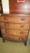 A Four drawer mahogany chest.