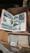 A box of early to mid 20th century postcards, maps etc.