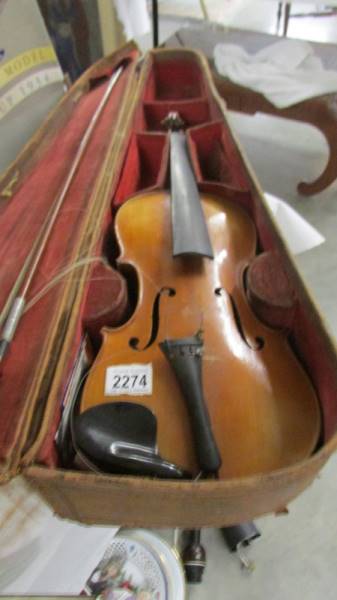 An old violin in leather case, a/f.