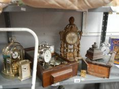 A Shelf of old clocks, some a/f.