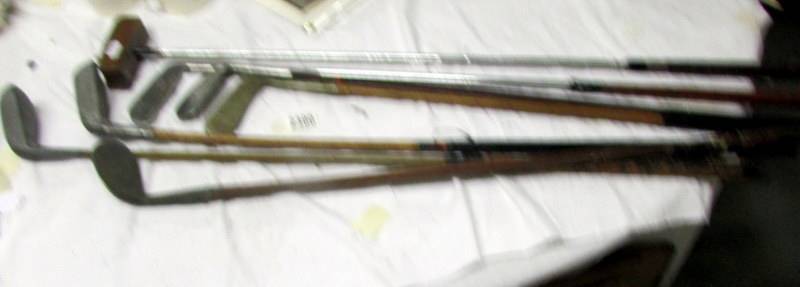 Seven vintage golf clubs including L Clark, W Smithson etc.