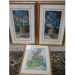 Two good prints of flowers and a watercolour.
