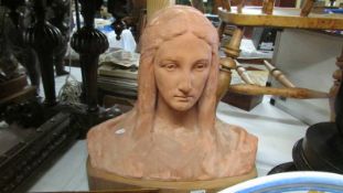 A large terracotta bust.