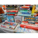 A quantity of old and later jigsaw puzzles, games etc.