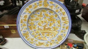 A large ceramic charger. ****Condition report**** Diameter 43cm, no damage, dished 6.