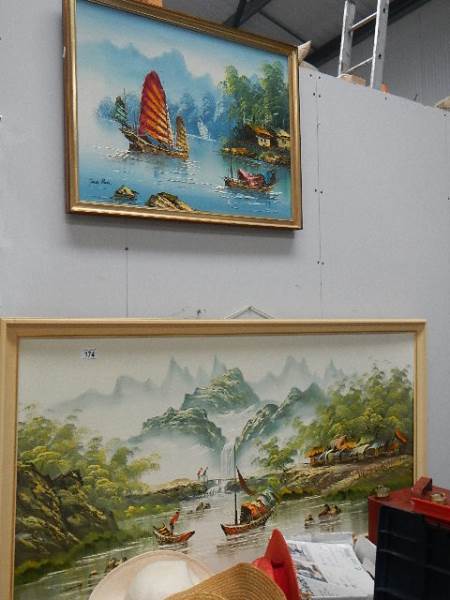 Two painting of Chinese scenes.