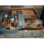 A large wooden box and a tool box full of tools.