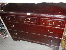 A mahogany chest of drawers.