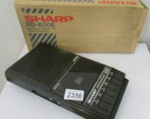 A boxed Sharp Rd. 620E Cassette recorder.