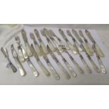 A set of fish knives and forks with mother of pearl handles and silver bands together with other