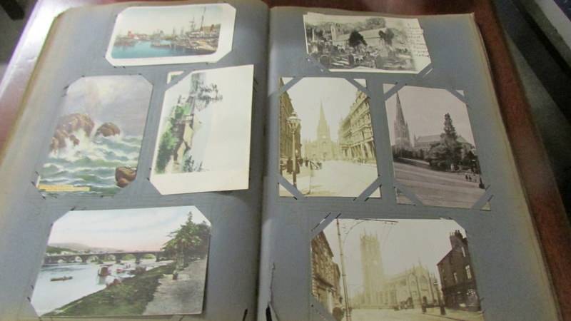 An album of approximately 180 vintage postcards. - Image 10 of 12