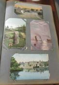 An album of approximately 180 vintage postcards.