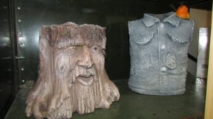 Two novelty resin garden planters being the green man and a denim jacket.