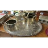 A silver plate tea set on tray.
