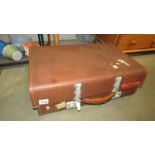 A vintage Revelation fibre glass suitcase and one other.