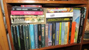 A box of Sci-Fi and fantasy books.