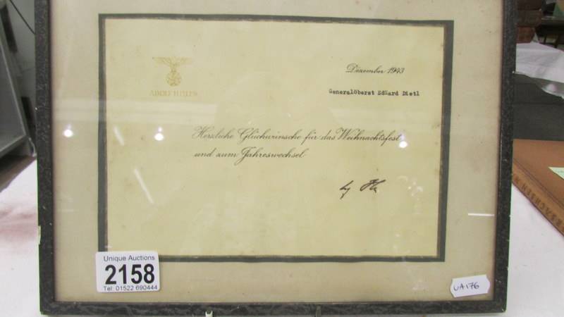A framed and glazed Adolf Hitler Christmas card to General Oberst Eduard Dietl,