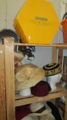 A large selection of ladies and gents hats including straw, fez etc., and 2 Selfridges hat boxes.