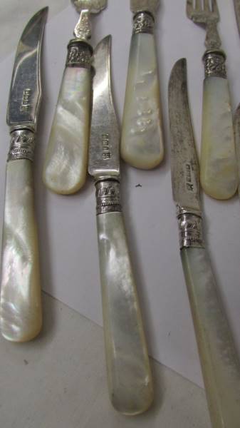 A set of fish knives and forks with mother of pearl handles and silver bands together with other - Image 3 of 4