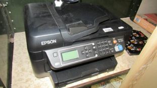 An Epsom Workforce WF-2650 printer and a quantity of replacement ink cartridges.