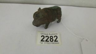 A small bronze boar.