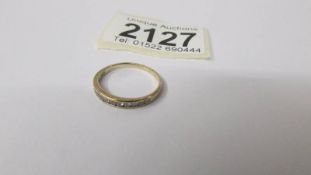 A 9ct gold half eternity ring set diamonds, size m half, 1.4 grams.