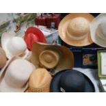 A mixed lot of vintage straw and other hats.