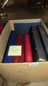 A box of 7 stamp albums part filled with GB mint stamps including 2 Stanley Gibbons part