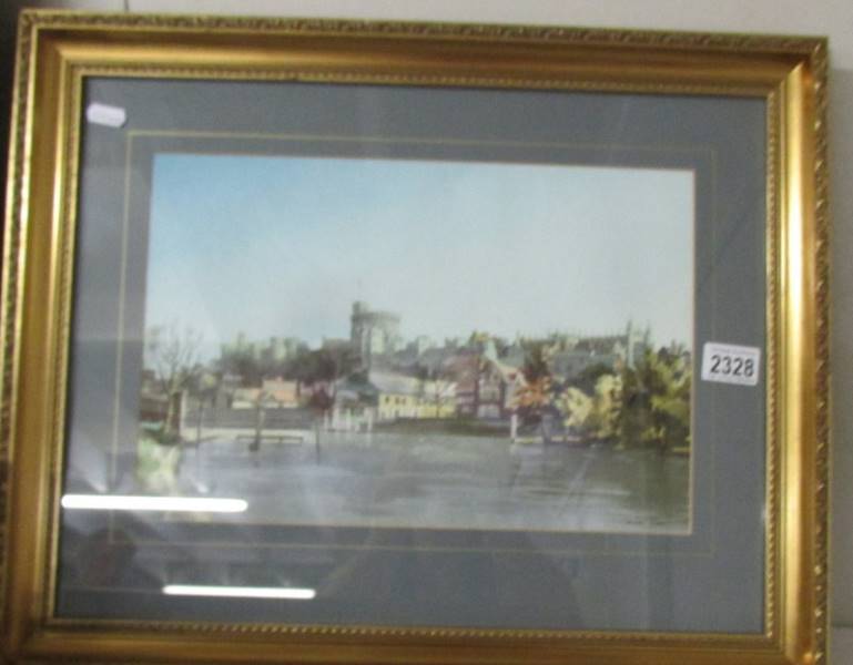 A framed and glazed watercolour river and castle scene signed Michael Vicary.