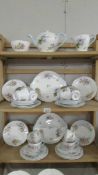 A Shelley tea set comprising teapot, sugar bowl, milk jug, 12 tea cups, 12 saucers,