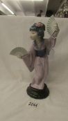 A Lladro "Madame Butterfly" #4991, 11.75 cm tall with original box.