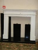 A good white fire surround with black marble base.