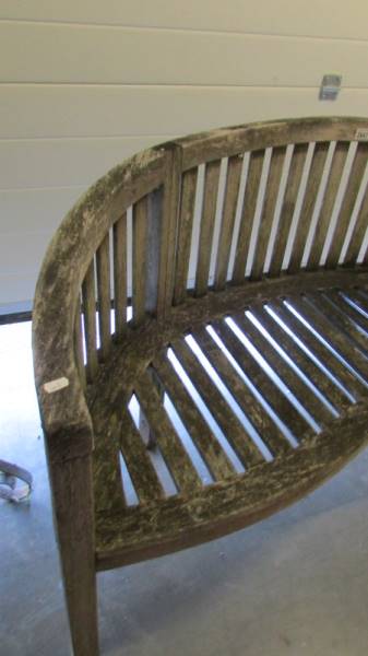 A curved garden bench. - Image 2 of 2