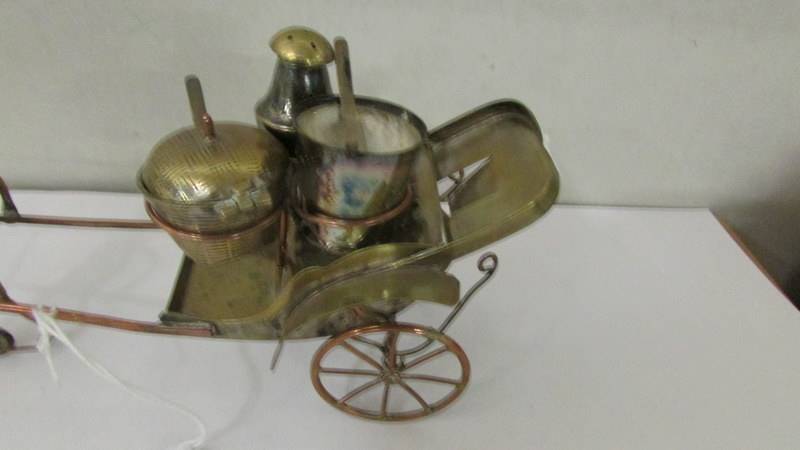 A nickel plated condiment set in the form of a rickshaw pulled by a Chinese man. - Image 3 of 3