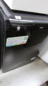 A black Beko dish washer, model DSFN 1530 B.