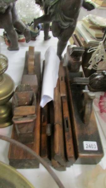 A quantity of old wood working planes including Thompson, various sizes.