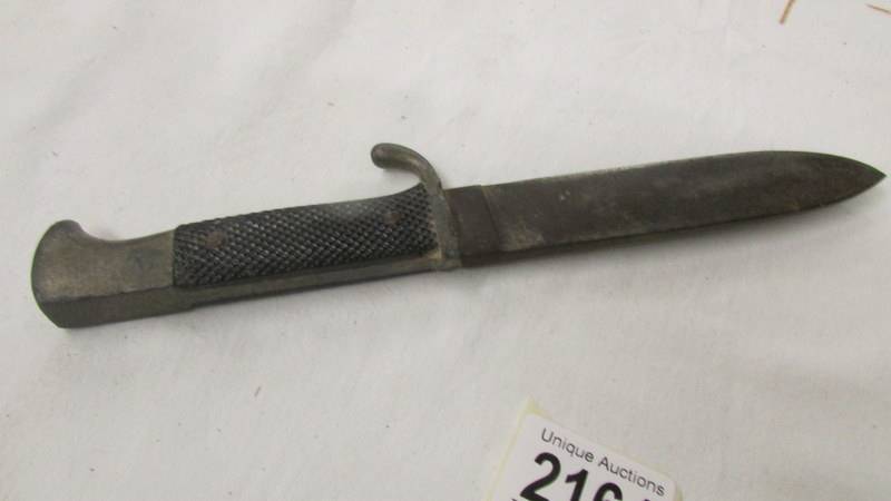 A WW2 German dagger with enamel insignia and stamped RZ M 7/27 1941 on blade. - Image 4 of 5