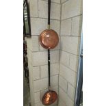 Two Victorian copper warming pans.