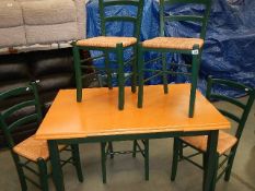 An extending dining table and 4 chairs.