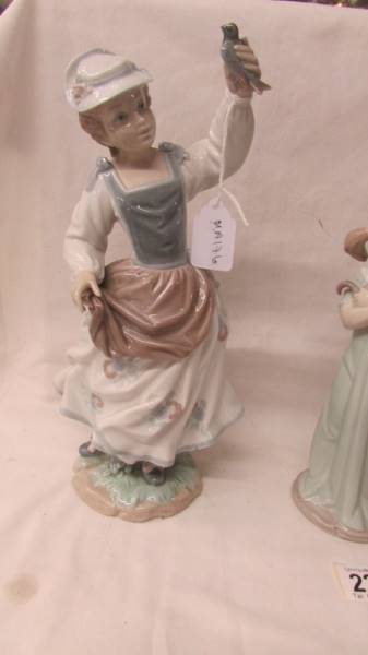 Three Lladro figures - Girl with goose and dog, girl with kittens and girl with bird. - Image 4 of 4