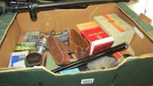 A box of miscellaneous photography items including tripods etc.