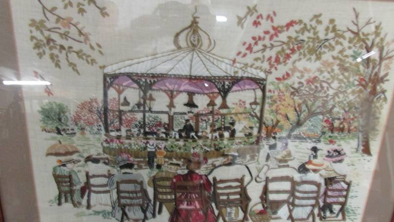 A framed and glazed embroidery depicting a Victorian band stand scene. - Image 2 of 2