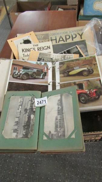 A box of assorted postcards and photographs.