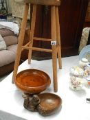 A stool and a wooden bowls.