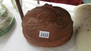 A Guernsey pottery terracotta chicken tureen.