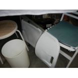 A quantity of white chairs, bins etc.
