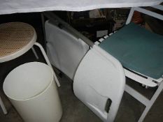 A quantity of white chairs, bins etc.